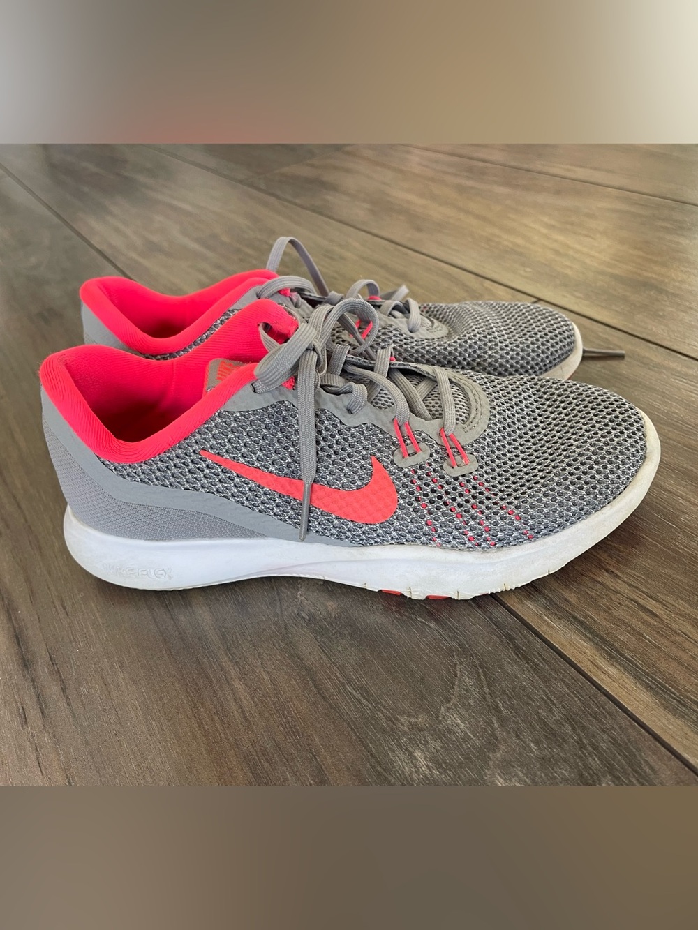 Nike Women's Flex Trainer 7 in the Wolf Grey and Racer Pink size 6.5